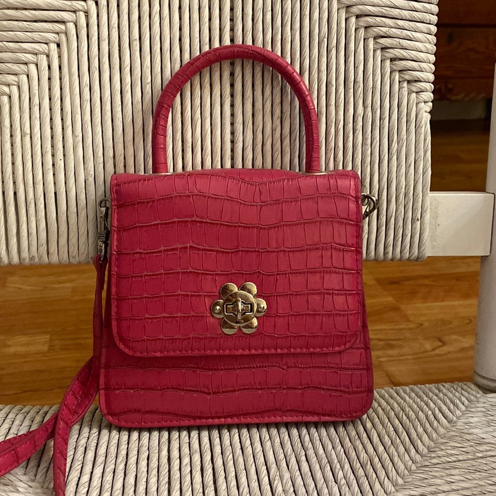 Urban outfitters pink crossbody bag.